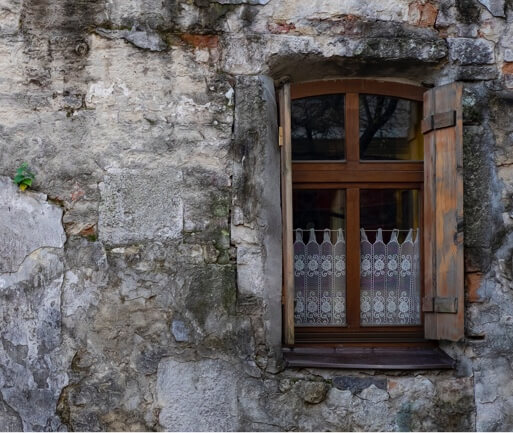 a concrete wall with a windowsill on its right side